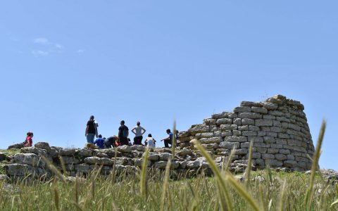 Spanish teenagers visiting the nuraghe