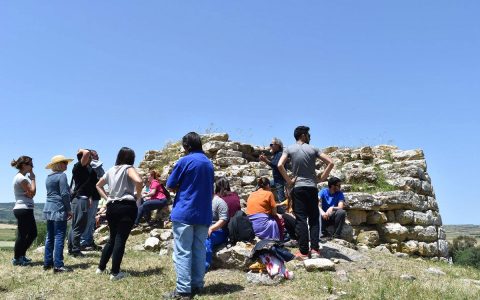 Spanish teenagers visiting the nuraghe